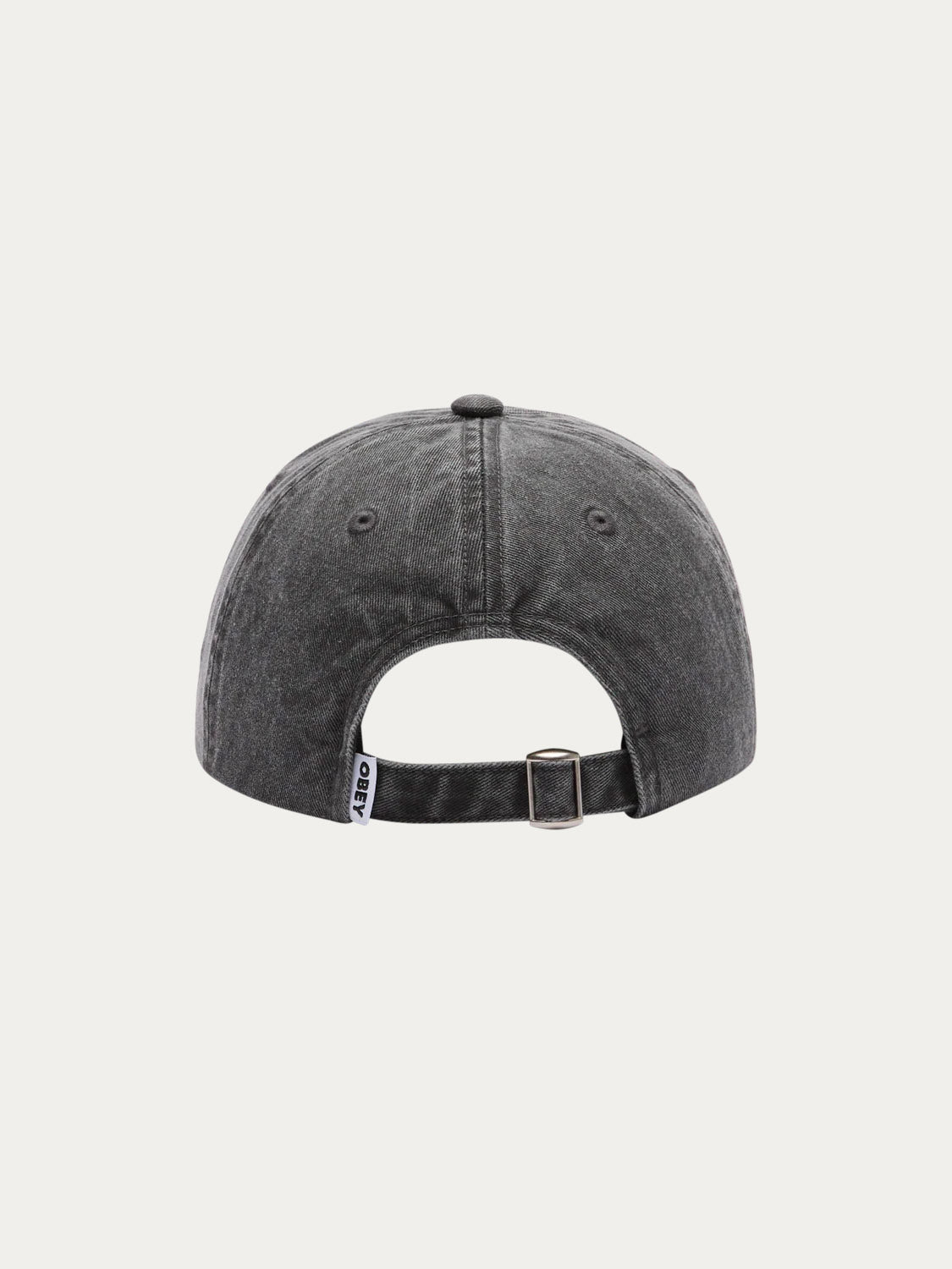 The Obey Pigment Bold 6 Panel Strapback is a black denim hat shown from the back, featuring an adjustable metal buckle strap and a small white label on the seam. Made from 100% cotton for comfort and durability.