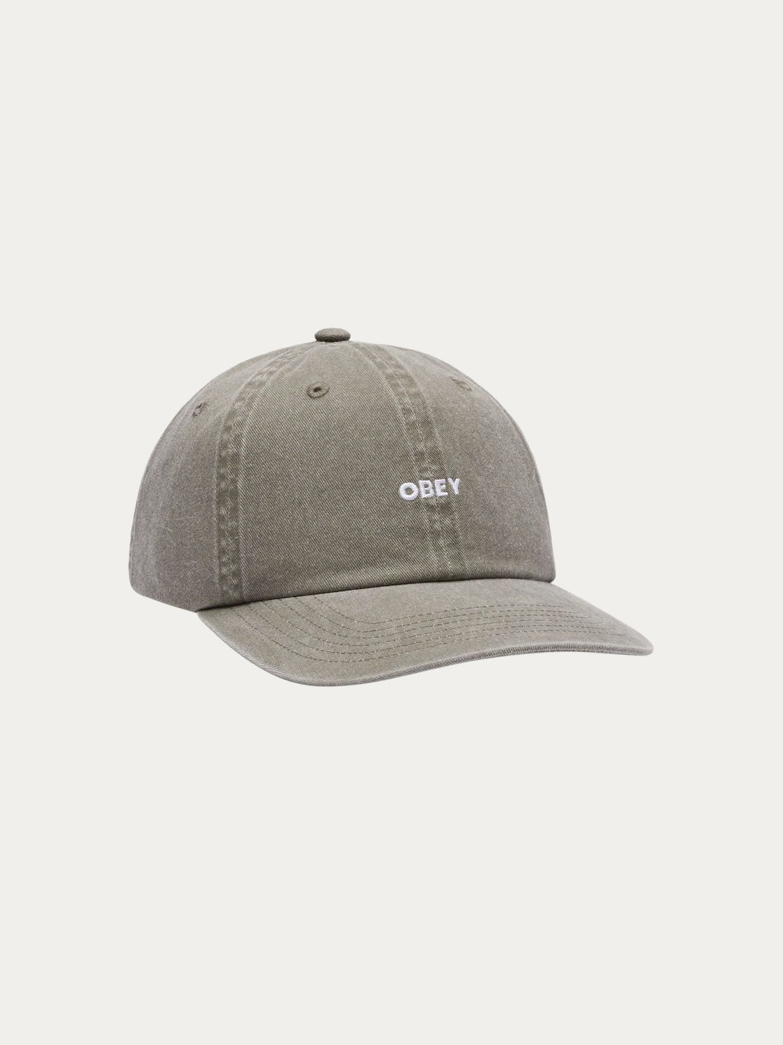 The Obey Pigment Bold 6 Panel Strapback is a grey 100% cotton baseball cap with visible stitching and the Obey logo embroidered in white on the front, featuring a classic strapback design against a plain white background.