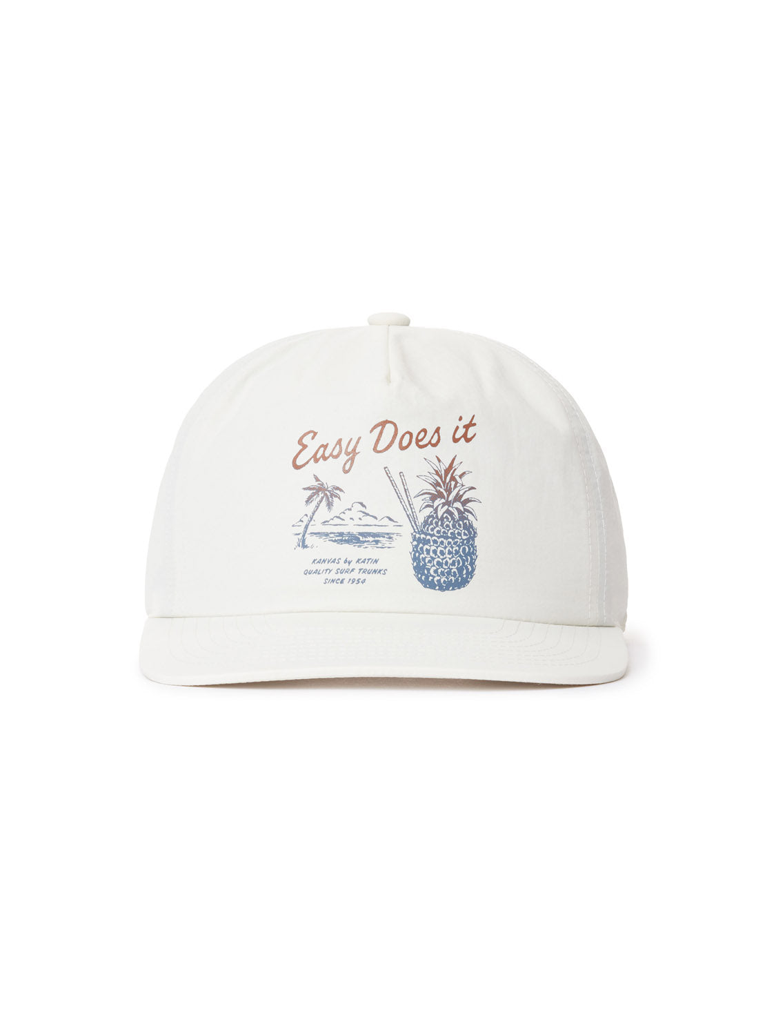 The Katin Pina Nylon Hat is a white baseball cap featuring a snapback closure and a print that reads Easy Does it above a beach scene with a palm tree, waves, and pineapple drink. It also includes Summer & Waves and Since 1983. Perfect for Katin headwear fans.