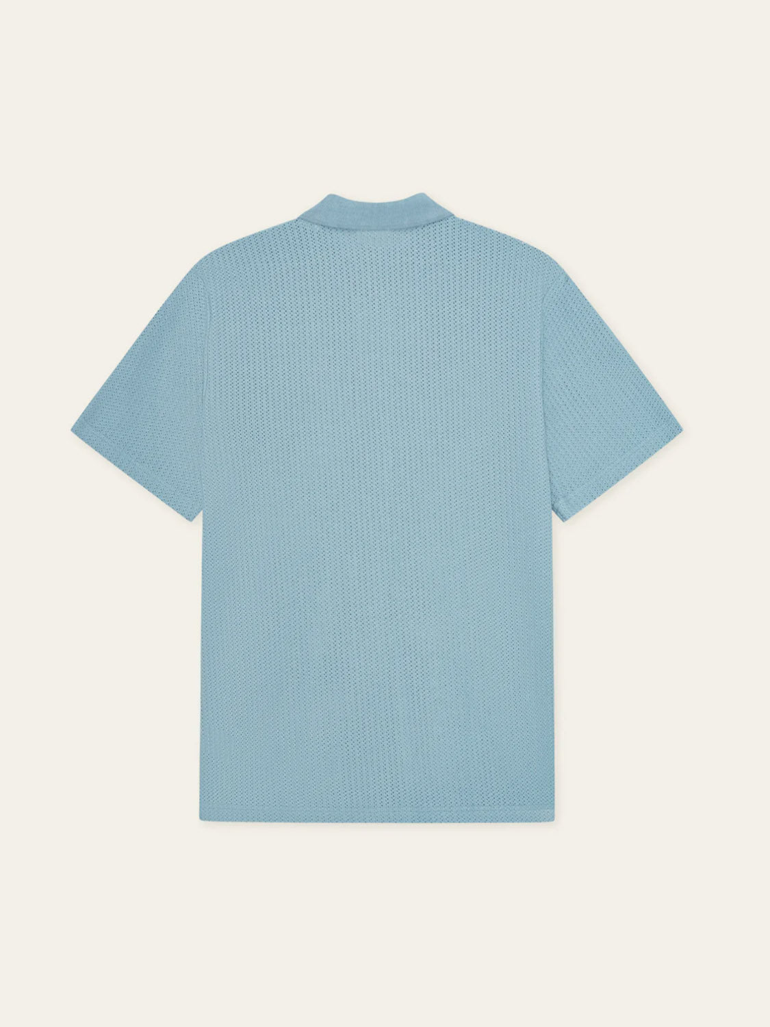 The Les Deux Pointelle SS Shirt is shown from the back in light blue, featuring a textured pattern and simple collar, displayed against an off-white background.