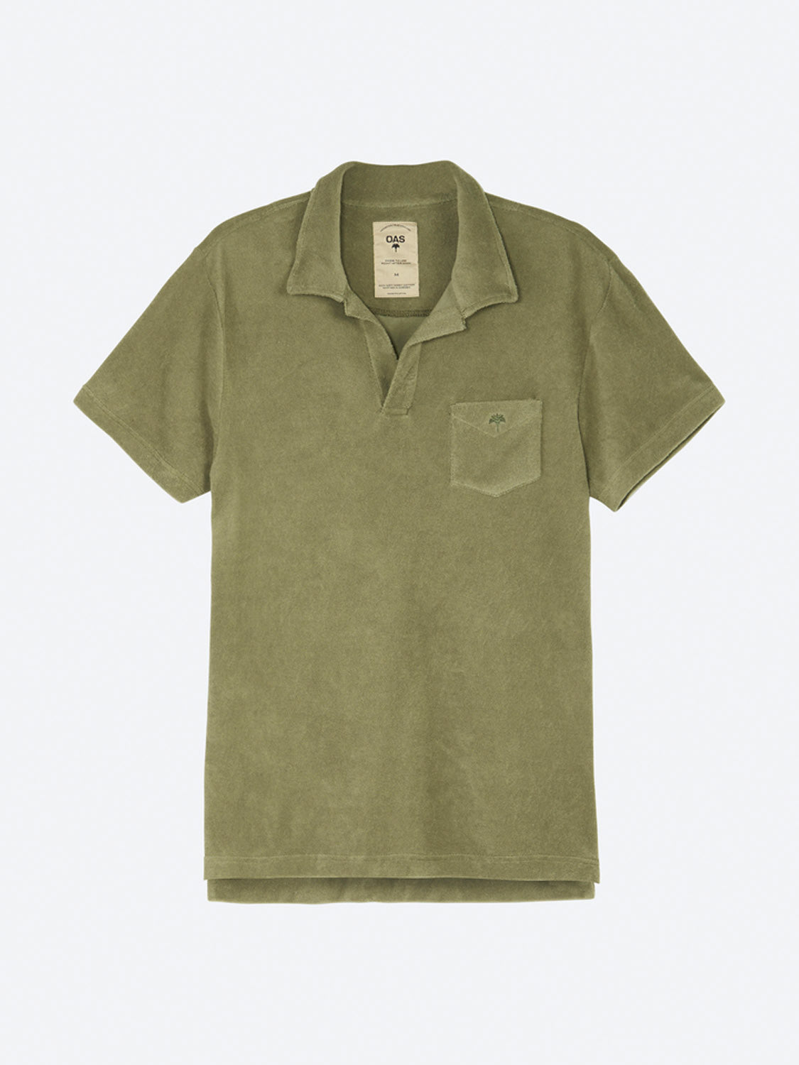 The OAS Polo Terry Shirt in olive green is made from breathable cotton terrycloth with short sleeves, an open collar, a chest pocket, and a small embroidered logo. Shown laid flat on a light gray background.
