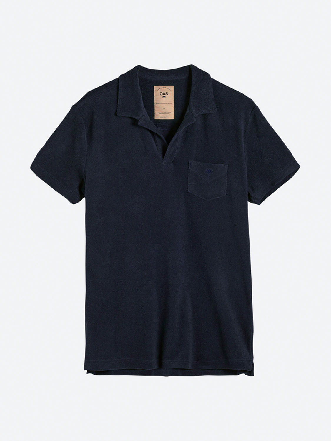 The OAS Polo Terry Shirt is a short-sleeved, navy blue top made from breathable cotton terrycloth with a left chest pocket and relaxed collar, shown on a plain light gray background.