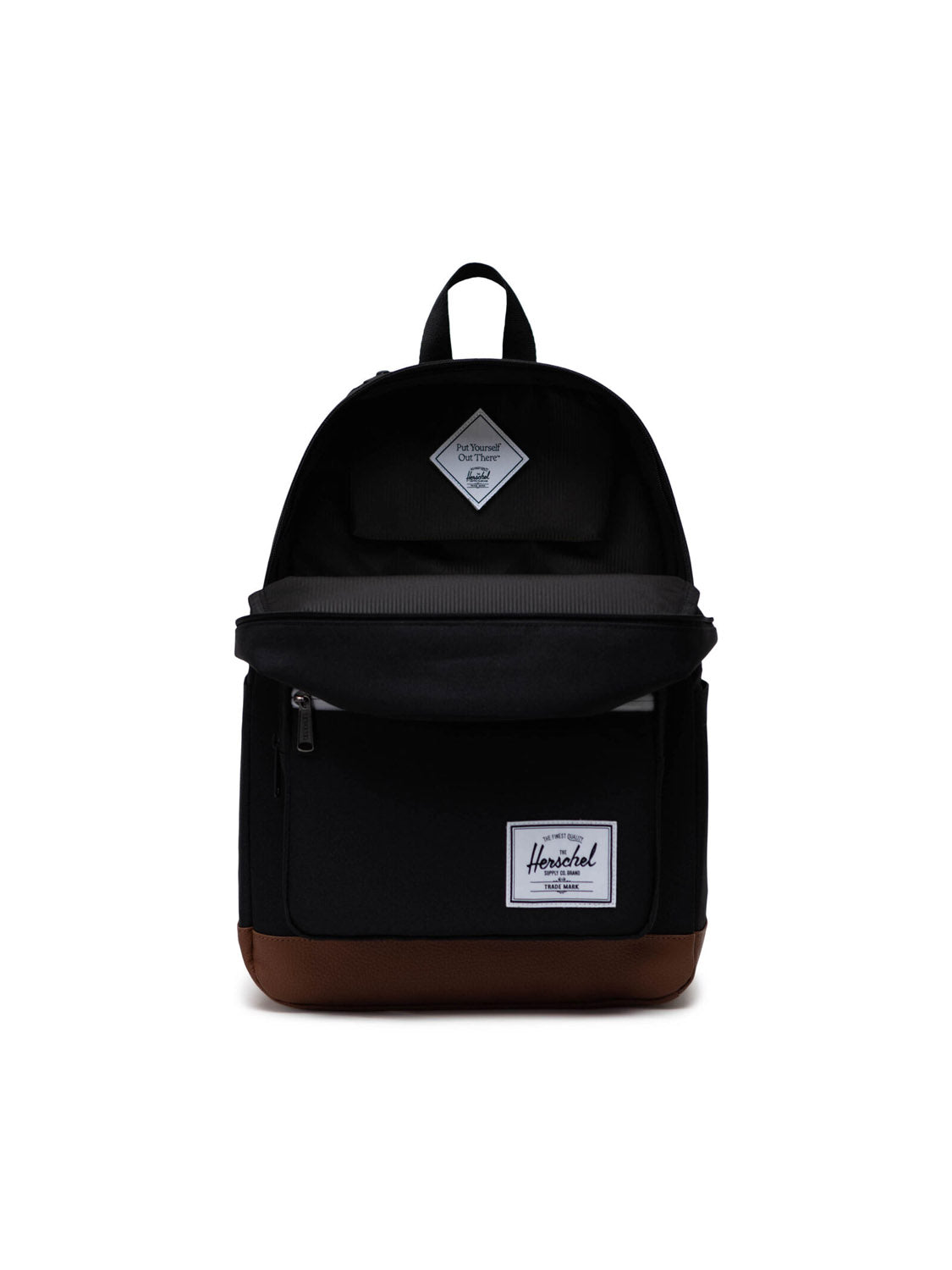 The Herschel Pop Quiz Backpack features a black EcoSystem fabric with a brown faux-leather bottom, front zippered pocket, top handle, white Herschel label, and a diamond-shaped logo patch near the top.