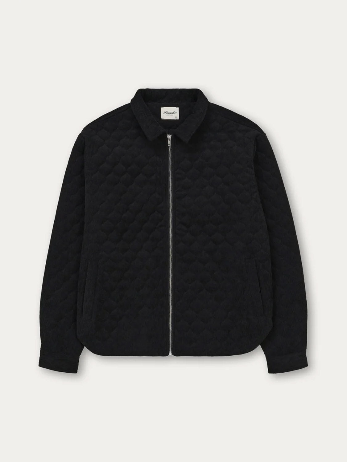 The Kuwalla Quilted Corduroy Shacket is a black jacket featuring quilted corduroy fabric, long sleeves, a classic collar, and a front zipper closure, displayed on a white background.