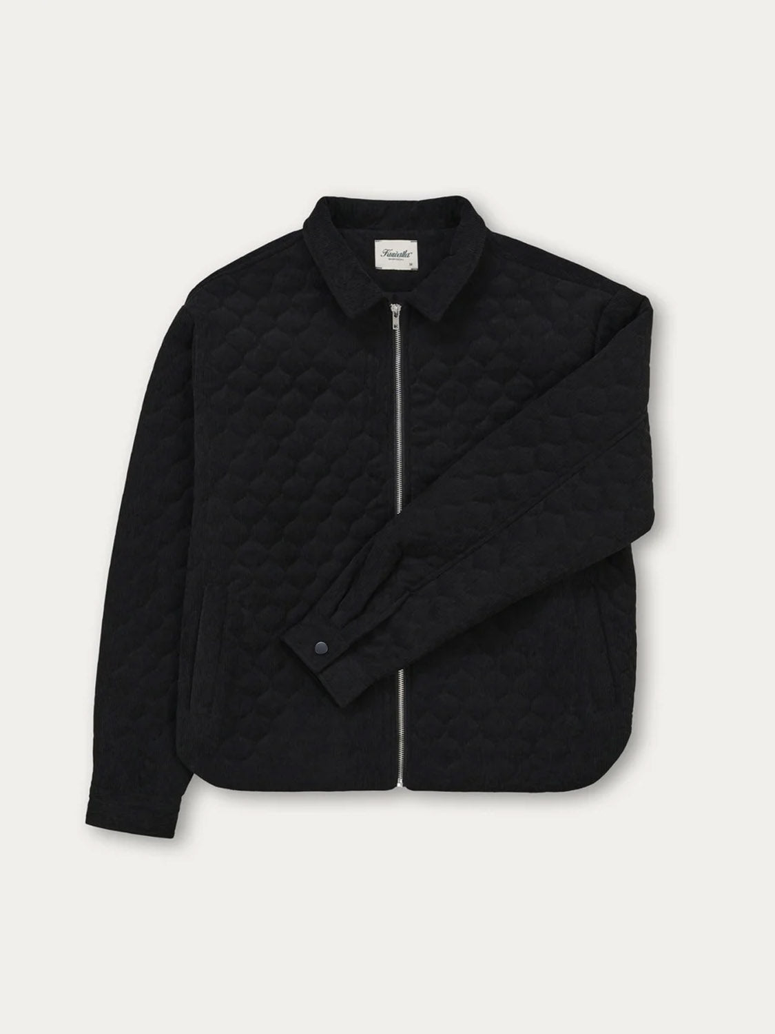 The Kuwalla Quilted Corduroy Shacket for men features a black diamond-quilted pattern, front zipper closure, pointed collar, long sleeves, and side pockets. Shown on a plain white background.