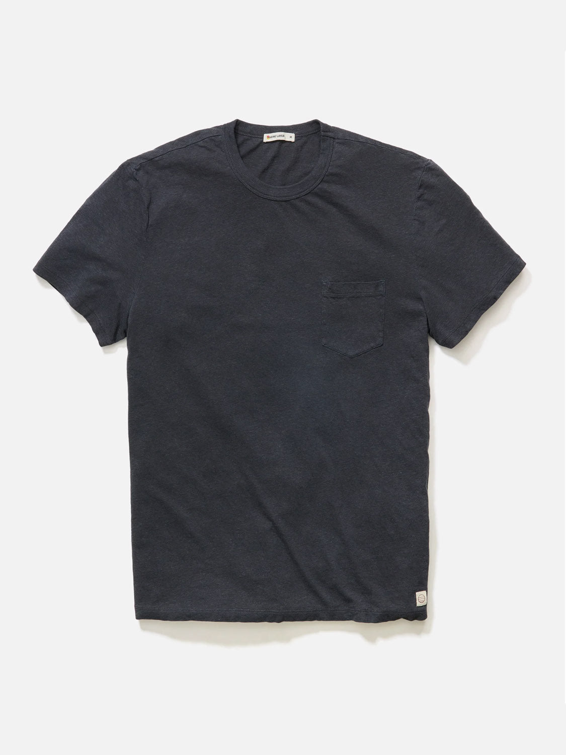 The Marine Layer Relaxed Hemp Cotton Tee from Marine Layer is a comfortable plain, dark gray T-shirt, featuring a round neckline and a small pocket on the left chest, displayed against a white background.