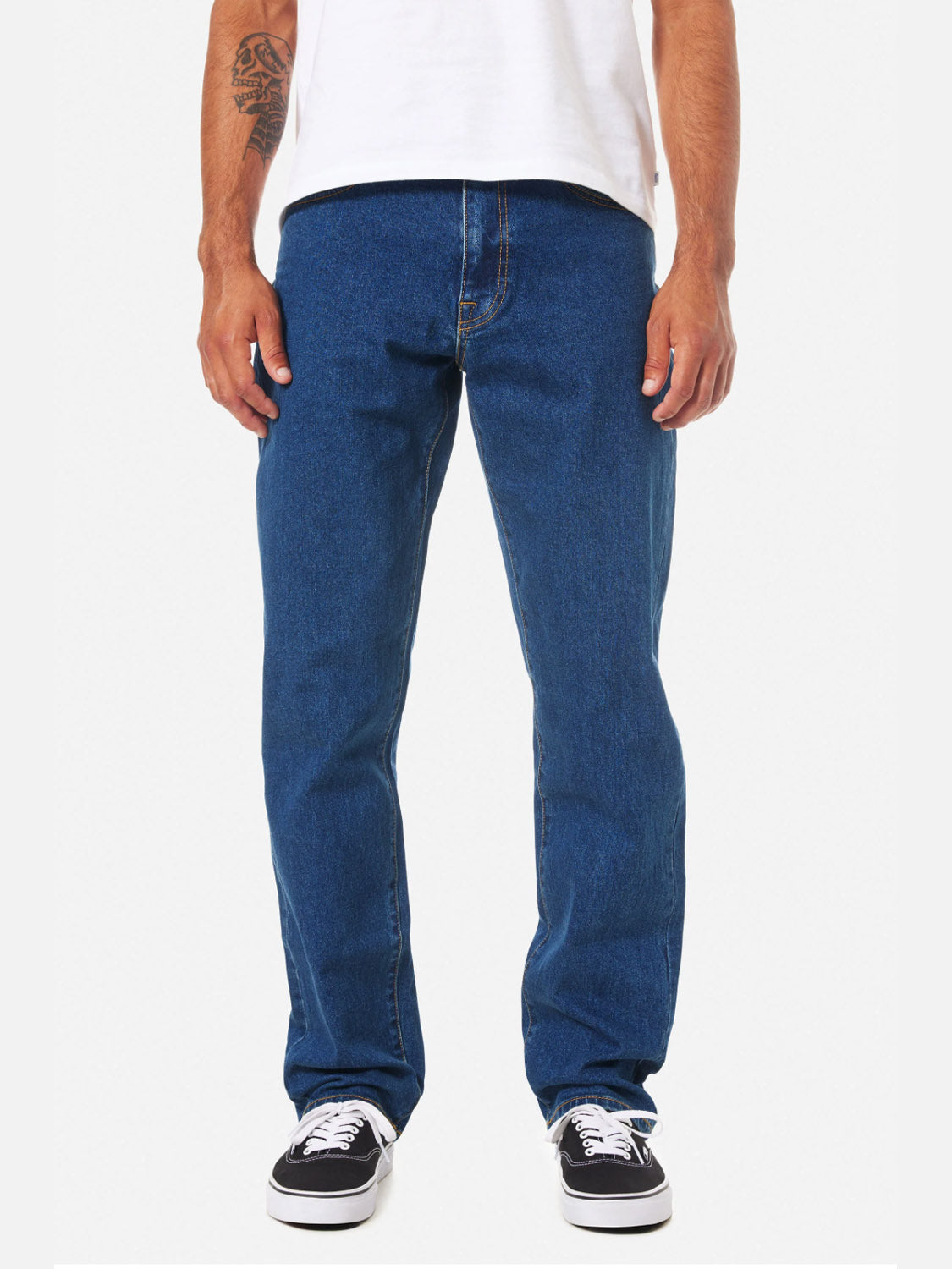 A person wearing a white t-shirt, Katin Ren 57 Classic Straight Pants, and black-and-white sneakers stands facing forward. Only the lower half is visible, showing a tattoo on the right forearm.