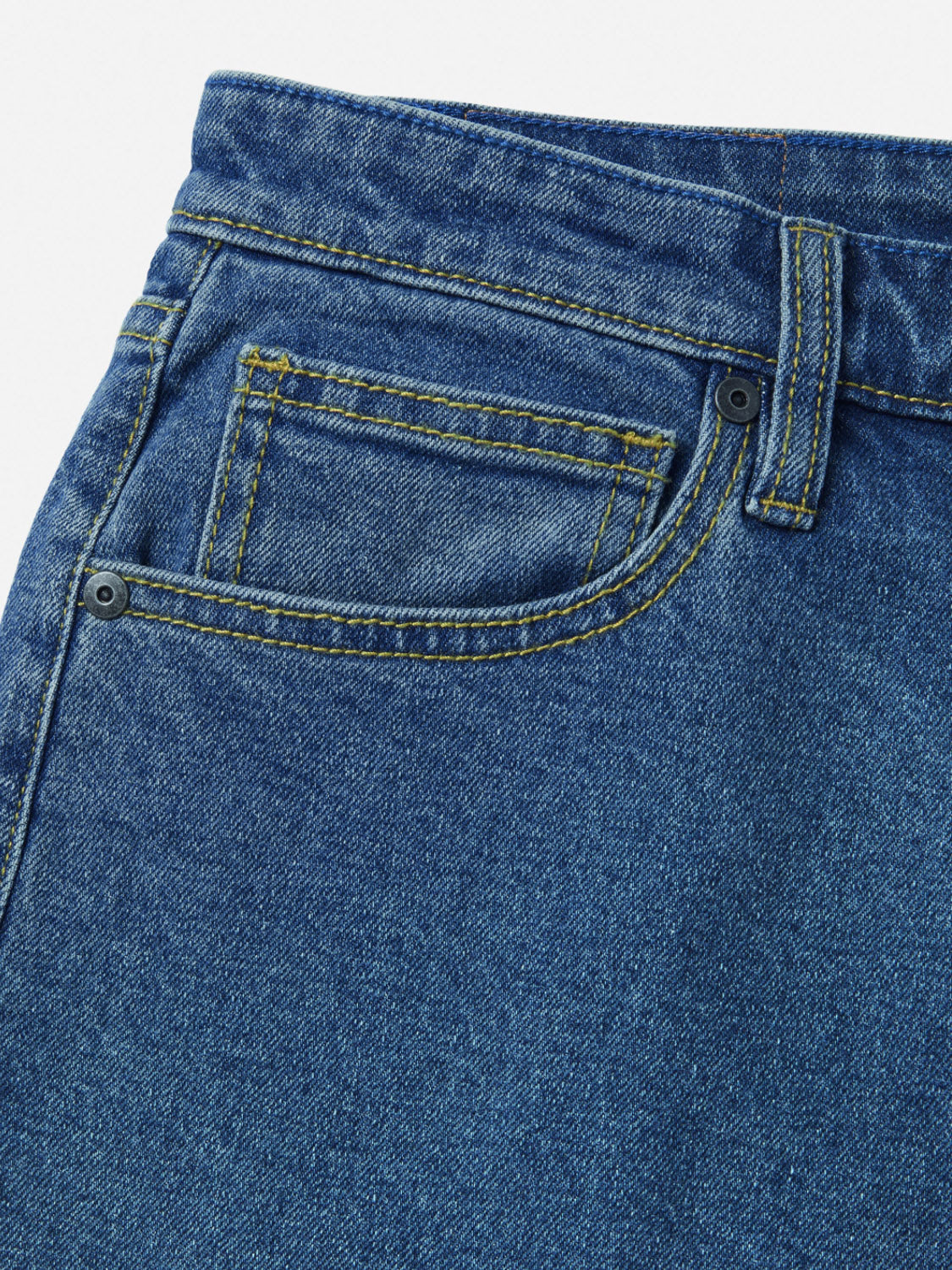 Close-up of the upper front of Katin Ren 57 Classic Straight Pants, featuring 5-pocket styling with a small coin pocket, yellow stitching, and a metal rivet on textured denim.
