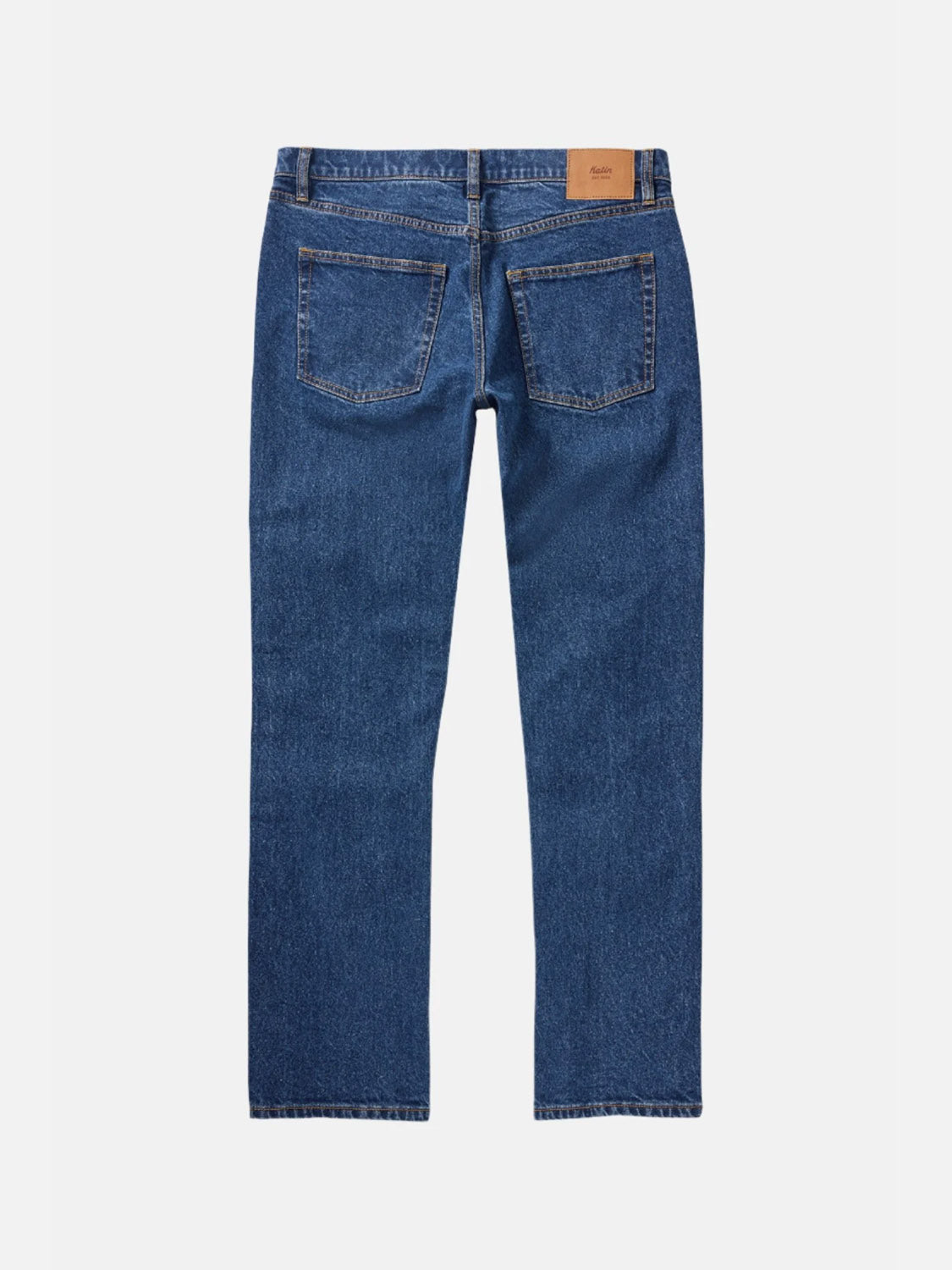 The Katin Ren 57 Classic Straight Pants are blue denim jeans with 5-pocket styling, two back pockets, contrast stitching, and a brown leather patch on the waistband, shown from the back.