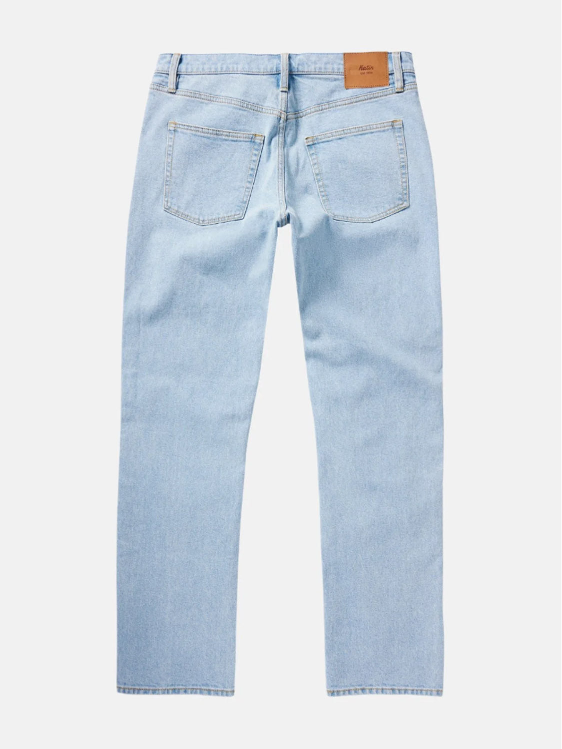The Katin Ren 57 Classic Straight Pants in light blue denim feature two rear pockets, belt loops, a brown leather patch on the right waistband, and signature 5-pocket styling, shown here from the back.