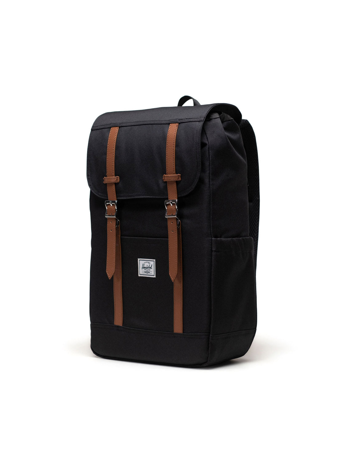 The Herschel Retreat Backpack is a black eco-friendly bag with brown leather straps, a top flap closure, padded shoulder straps, side pockets, and a front white label—ideal for laptops.