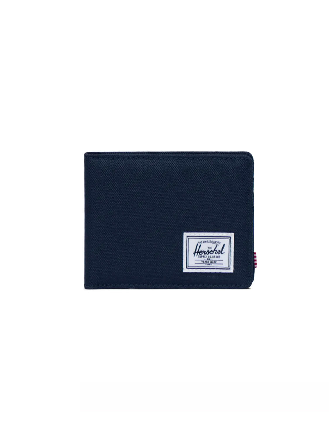 The Herschel Roy Classic Folded Wallet in black fabric features a white rectangular logo label on the front and is shown against a plain white background.