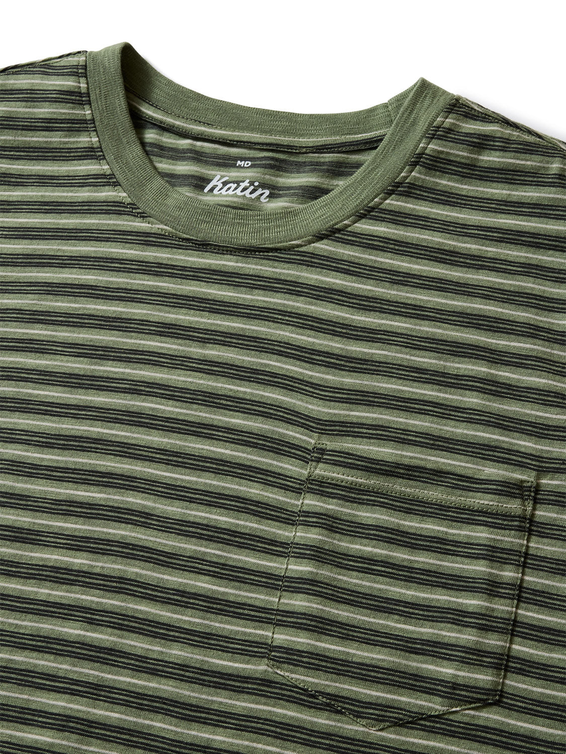 The Katin Rural Pocket Tee features green and black stripes, a round neckline, and a small left chest pocket. Made from premium cotton, it displays the Katin label at the neck and is shown flat against a white background.