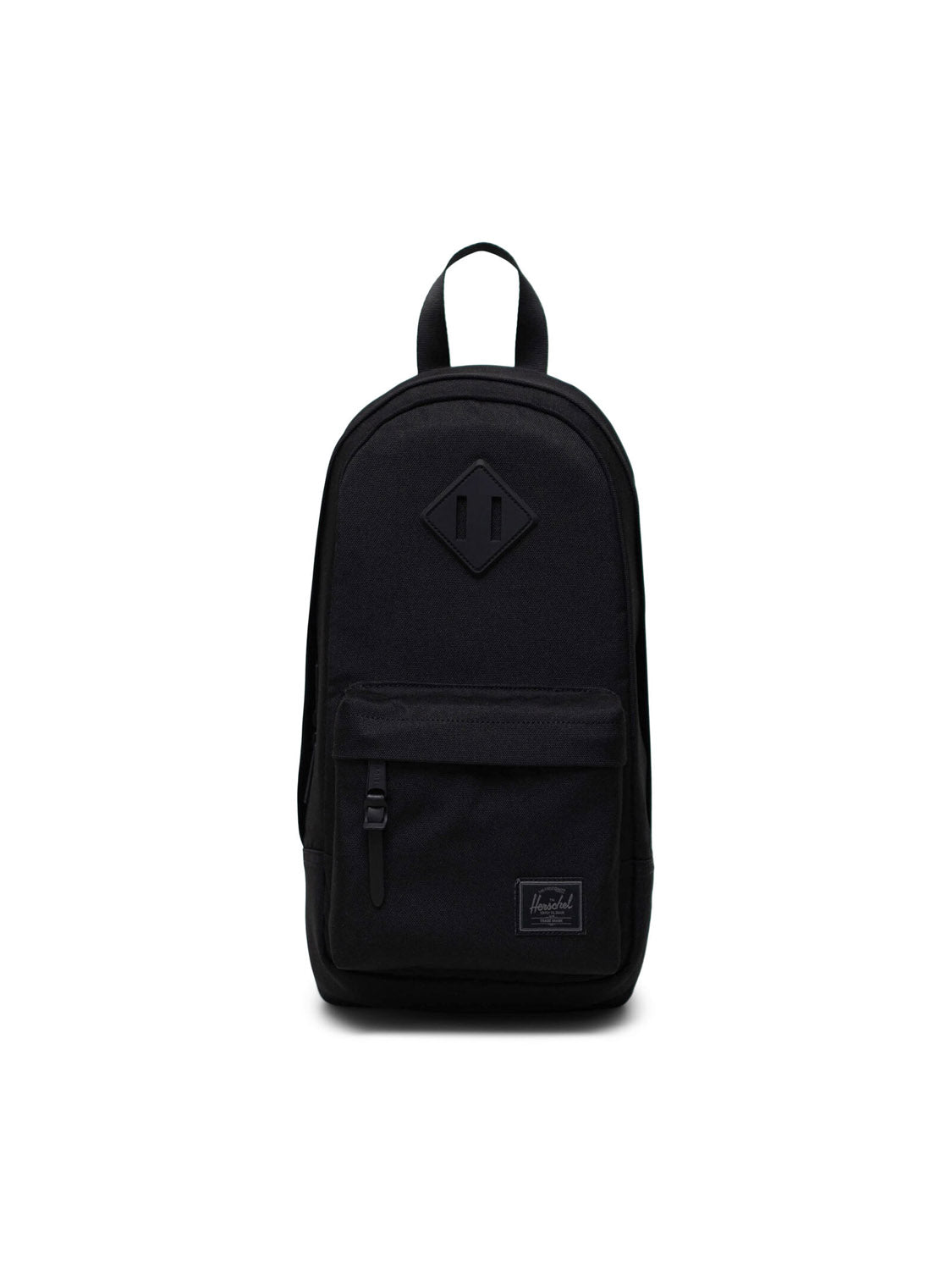 The Herschel Heritage Shoulder Bag is a minimalist black crossbody backpack featuring a front zippered pocket, top handle, patch label near the bottom, and a signature diamond-shaped detail on the front.