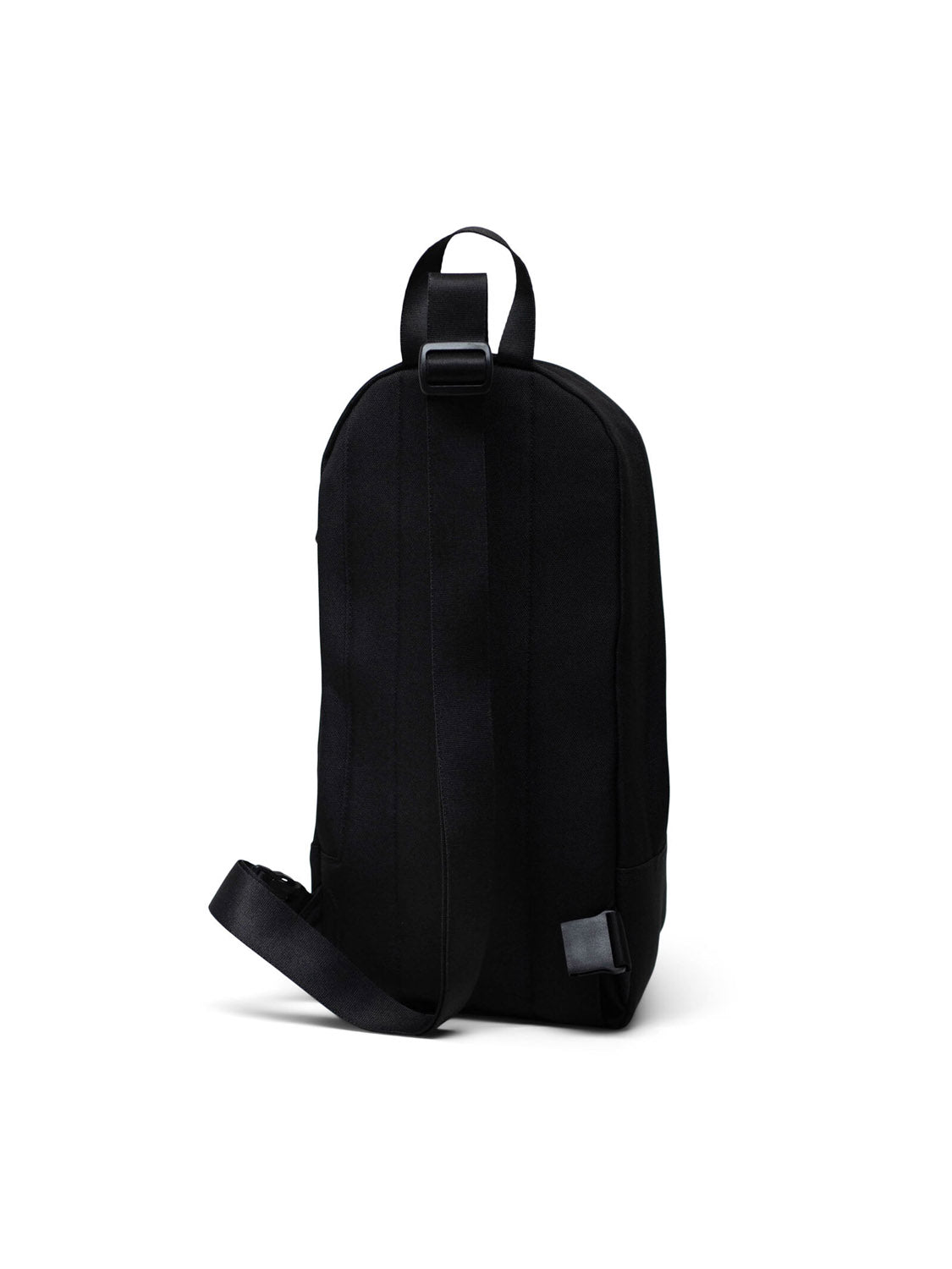 The Herschel Heritage Shoulder Bag is a black, oversized bag featuring a single wide adjustable strap and top handle, with a minimalist design—no visible logos or external pockets—displayed against a plain white background.