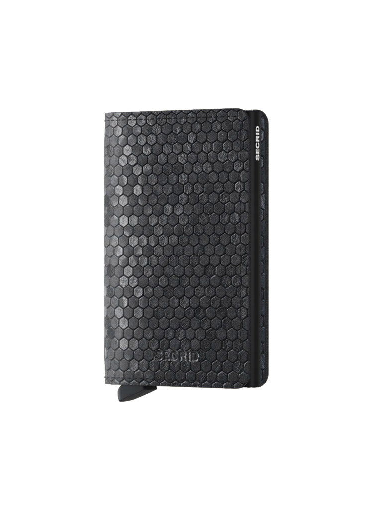 The Secrid Slimwallet Hexagon is a black premium leather wallet with a hexagonal texture, a small bottom tab, and RFID protection, shown on a plain white background.