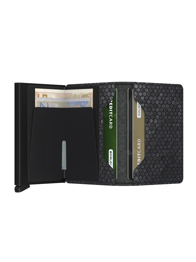 The Secrid Slimwallet Hexagon is a black leather wallet with a textured pattern and RFID protection, shown holding Euro banknotes and two “CREDIT CARD” cards. Its compartments and card slots are clearly visible.