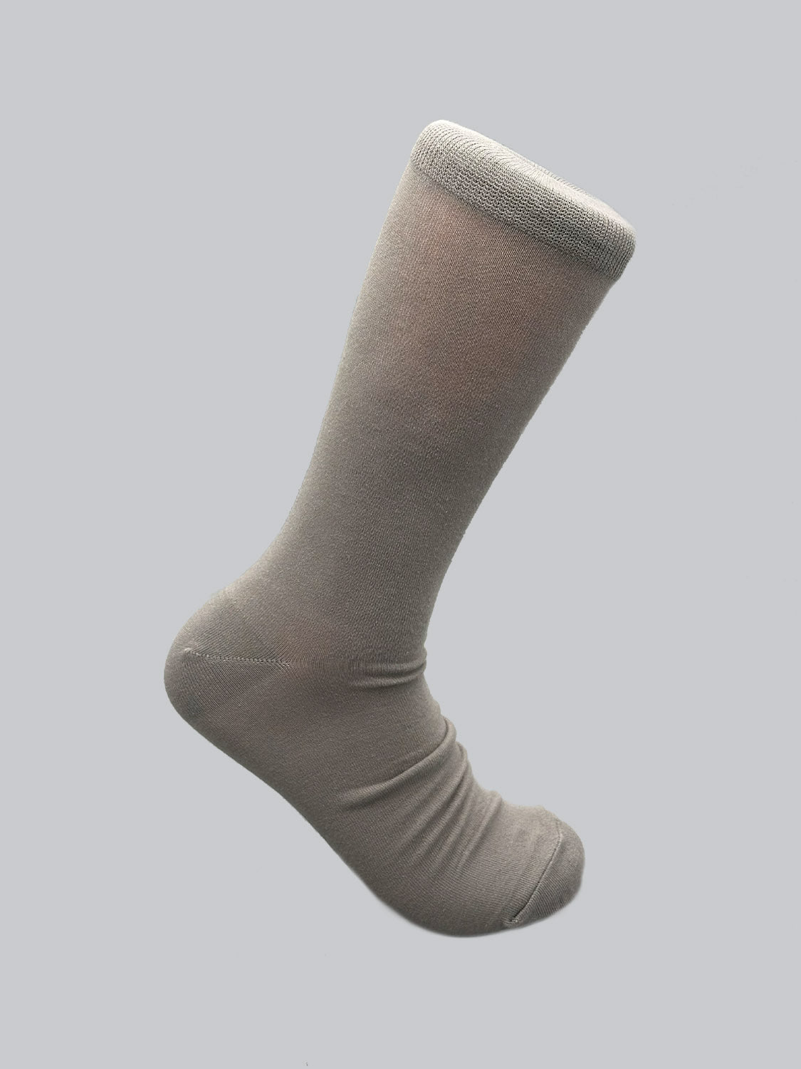 A single ID Cotton Sock by ID Menswear is displayed against a light grey background. The grey sock stands upright, highlighting its full length and smooth texture, offering breathable comfort for all-day wear.