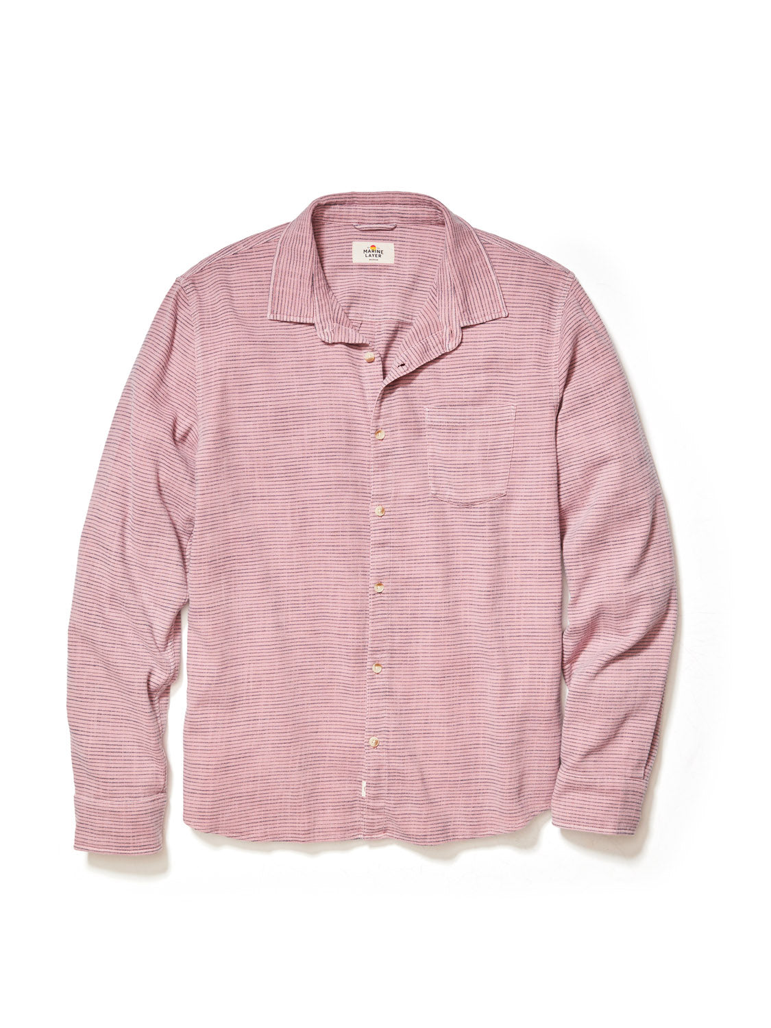 The Marine Layer Stretch Selvage Long Sleeve Shirt features a light red and white pinstripe, wide collar, and chest pocket. Its added stretch provides comfort and classic charm. Laid flat on a white background, its effortlessly stylish.