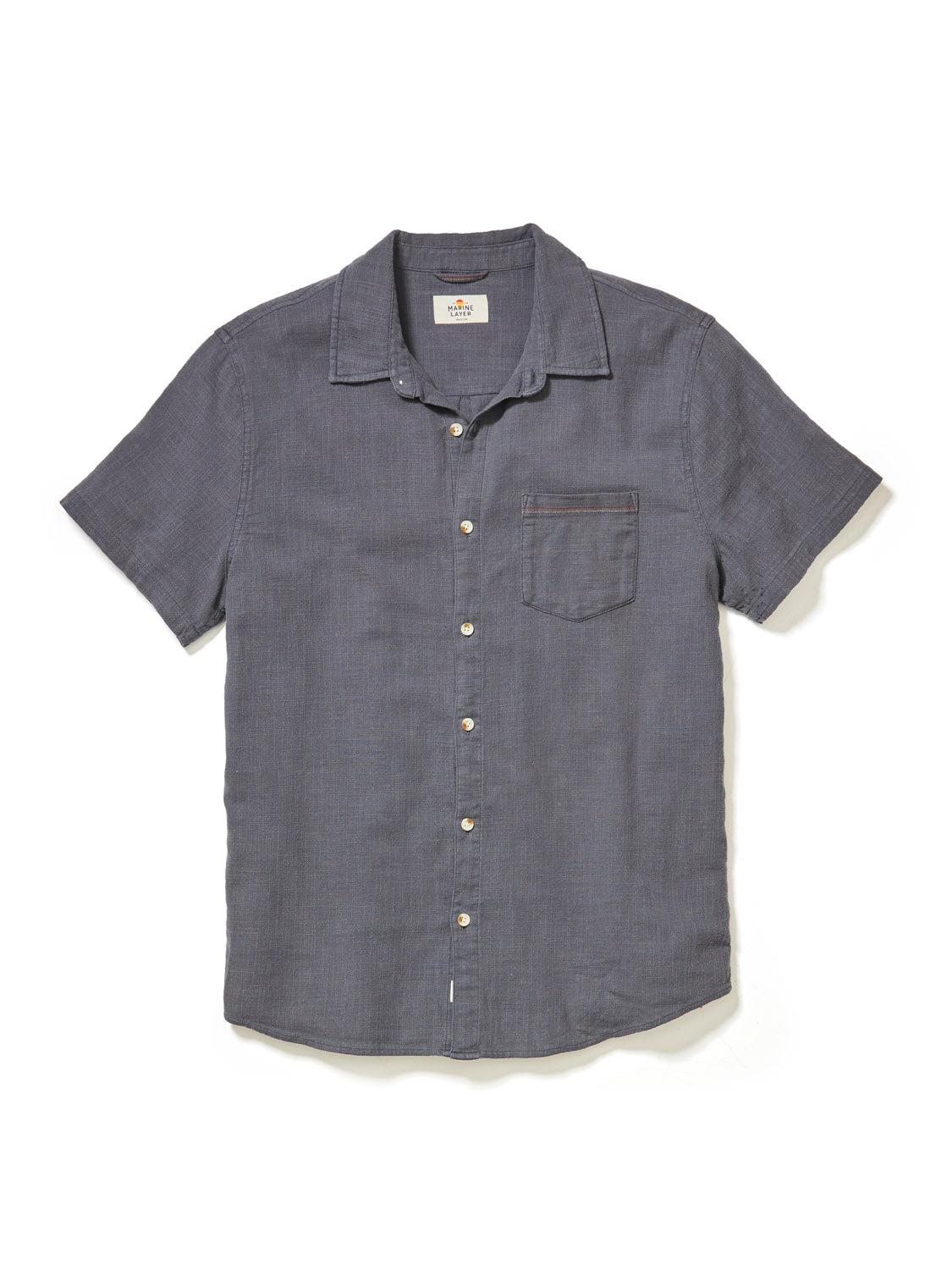 The Marine Layer Stretch Selvage Short Sleeve Shirt is dark gray with a single chest pocket and classic collar. Its a casual, comfortable shirt displayed on a white background, enhanced with added stretch for comfort.