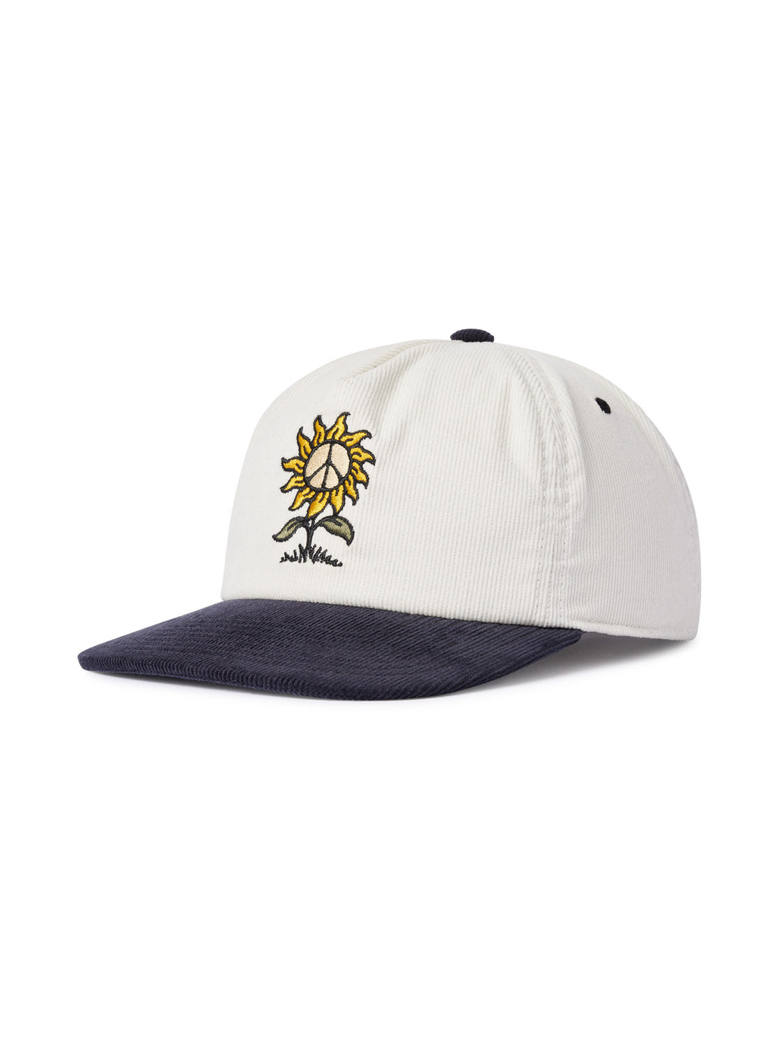 The Katin Sunflower Corduroy cap by Katin is a white cotton corduroy baseball cap with a dark brim and a sunflower graphic with a cheerful face. It features an adjustable strap for the perfect fit.
