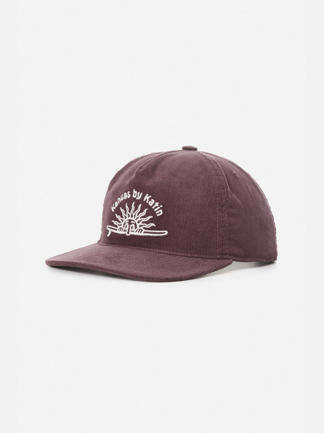 The Katin Sunny Hat is a dark purple corduroy cap featuring white Kansas by Katin embroidery and a sun design, with its curved brim angled slightly.