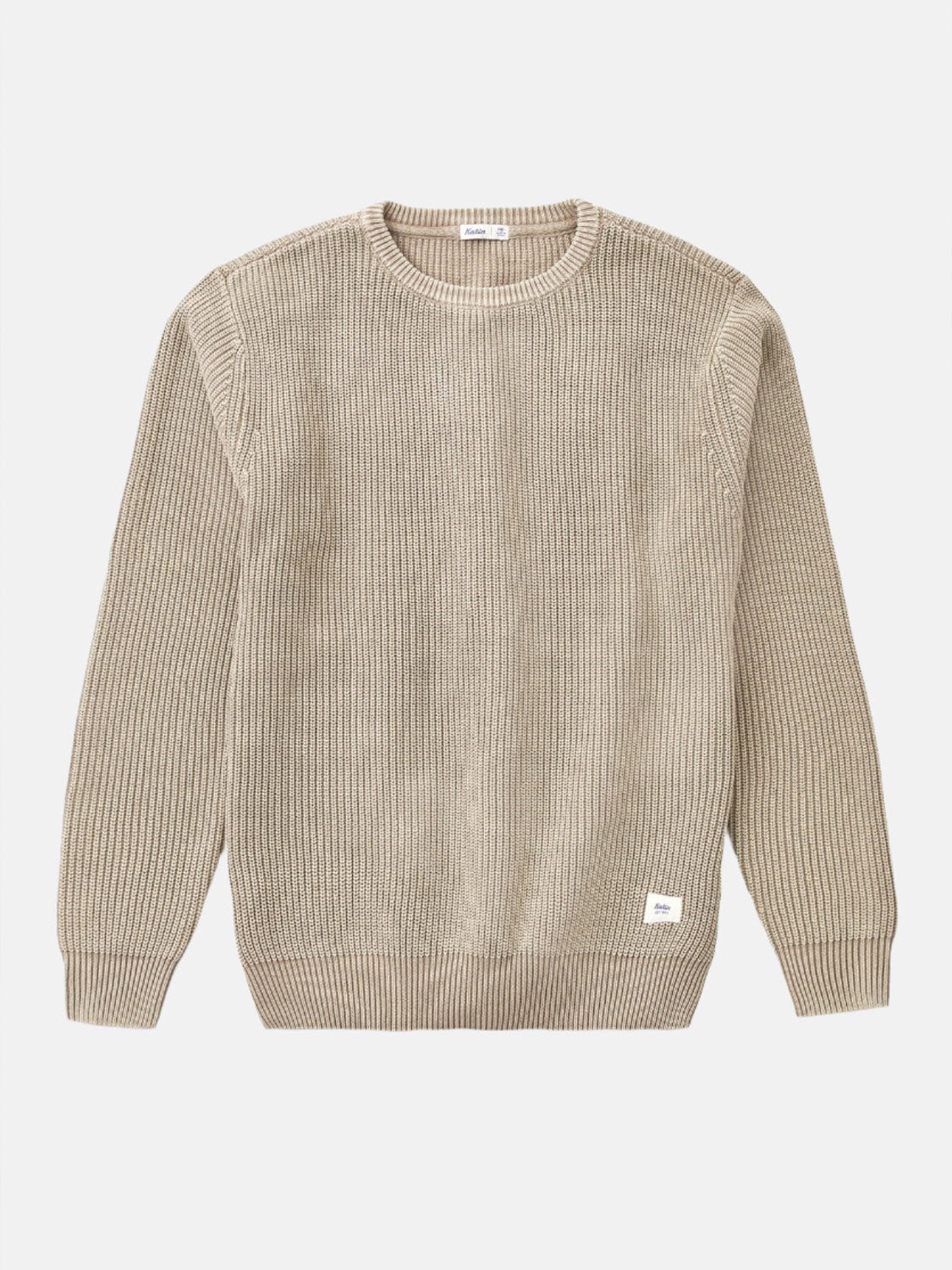 The Swell Sweater by Katin is a beige ribbed cotton crewneck with long sleeves, shown laid flat on a white background. A small white label decorates the lower left hem.
