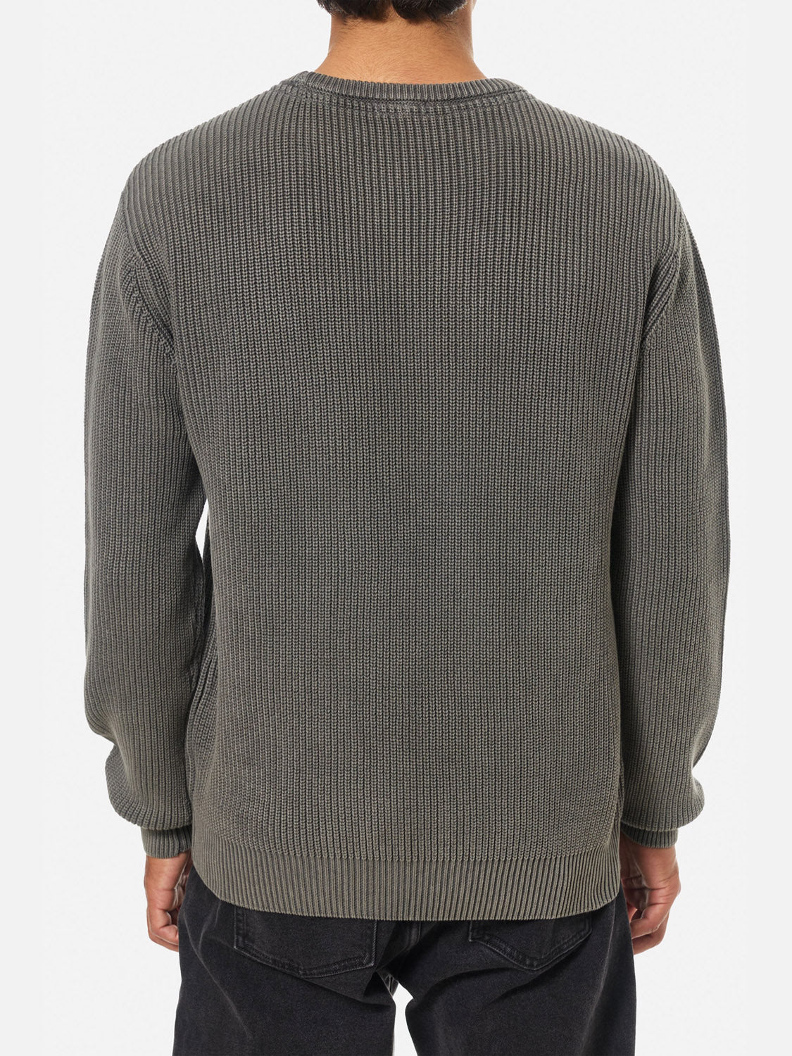 A person is shown from the back wearing the Katin Swell Sweater in gray with a ribbed knit texture and dark pants, set against a plain white background.