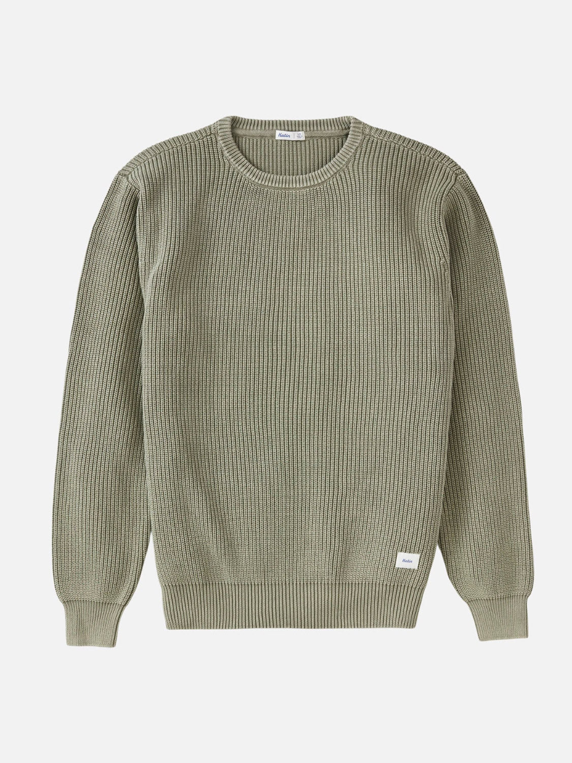 The Katin Swell Sweater is a light olive green ribbed cotton piece with long sleeves and a crew neckline, shown laid flat on a white background. A small white rectangular tag appears near the bottom hem.