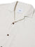 Close-up of a cream-colored Katin Teller Shirt featuring dark buttons, a camp collar, and a lightweight, subtly textured rayon linen blend. The white tag inside displays the Katin brand text.