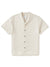 The Katin Teller Shirt, a luxurious rayon linen blend from Katin, offers a minimalist look with dark buttons, a relaxed camp collar, and beige short sleeves. Its effortless style is elegantly highlighted against a plain white background.