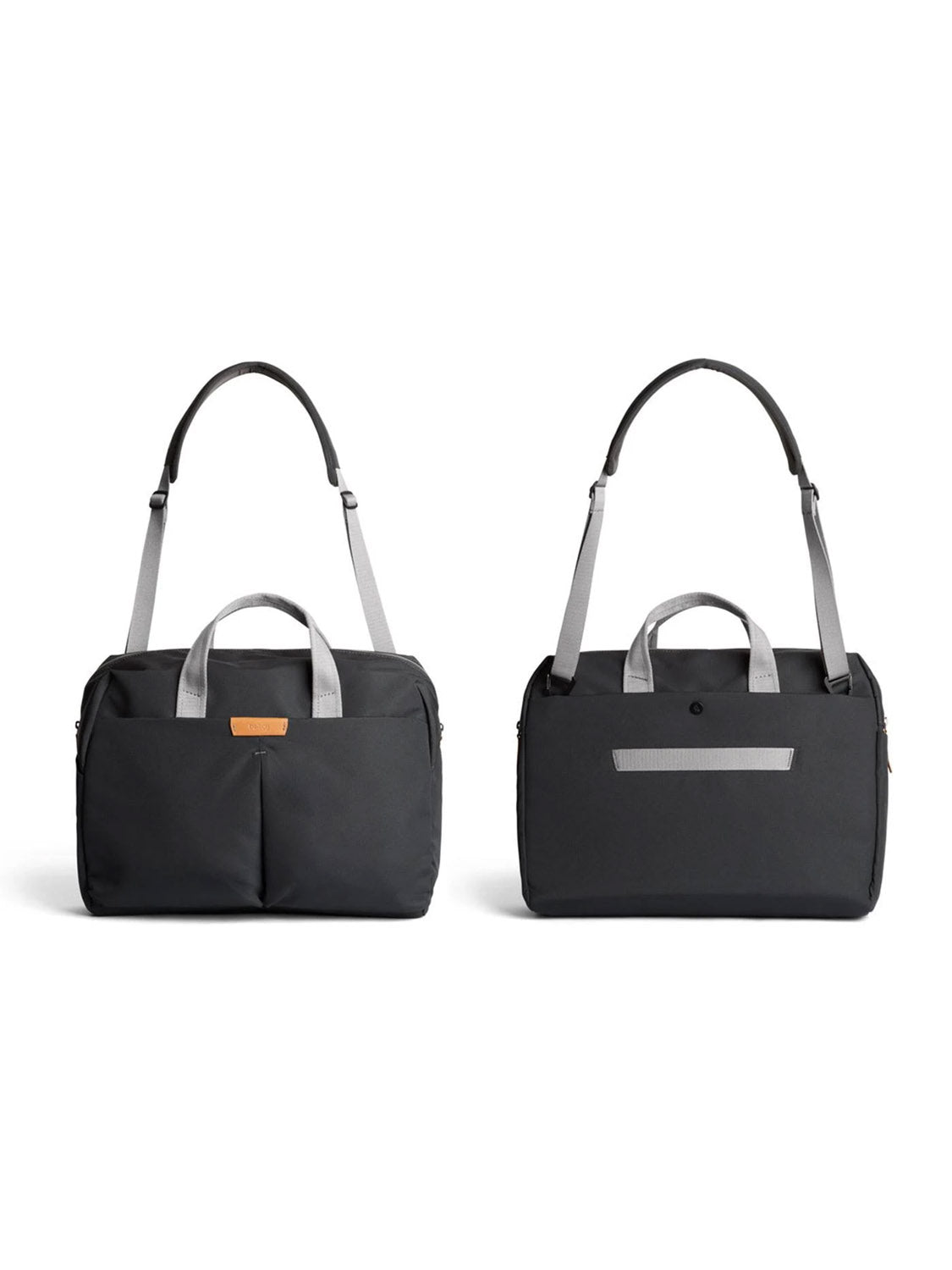 The Bellroy Tokyo Work Bag - 20L comes in black with light gray handles, dual front pockets, a small brown label, a horizontal strip and buttoned pocket on the back, plus room for a 16” laptop—ideal for commuting professionals.