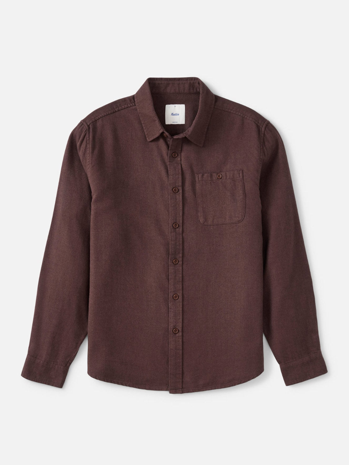 The Katin Twiller Flannel Button Down Shirt is a dark brown 2-tone twill weave flannel shirt with long sleeves, a single chest pocket, and a soft moleskin finish, shown laid flat on a white background.