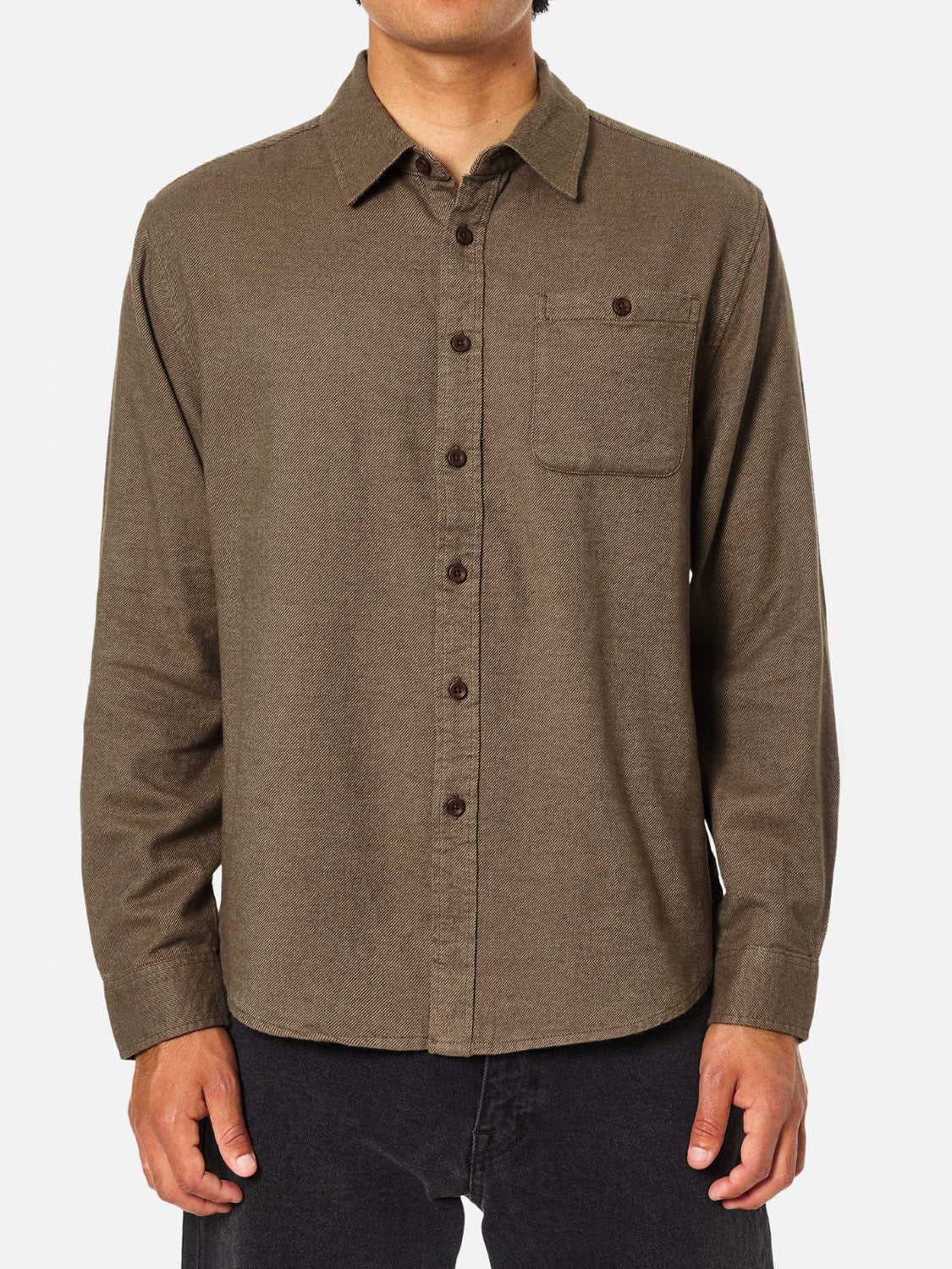 A person wearing the Katin Twiller Flannel Button Down Shirt in brown with a single chest pocket and black pants stands against a plain white background, their face not visible.