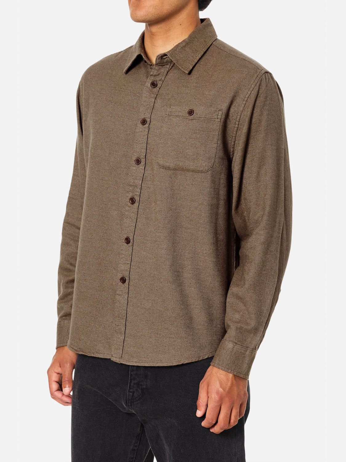 A person wearing the Katin Twiller Flannel Button Down Shirt in brown with a chest pocket and black pants, standing against a plain white background.