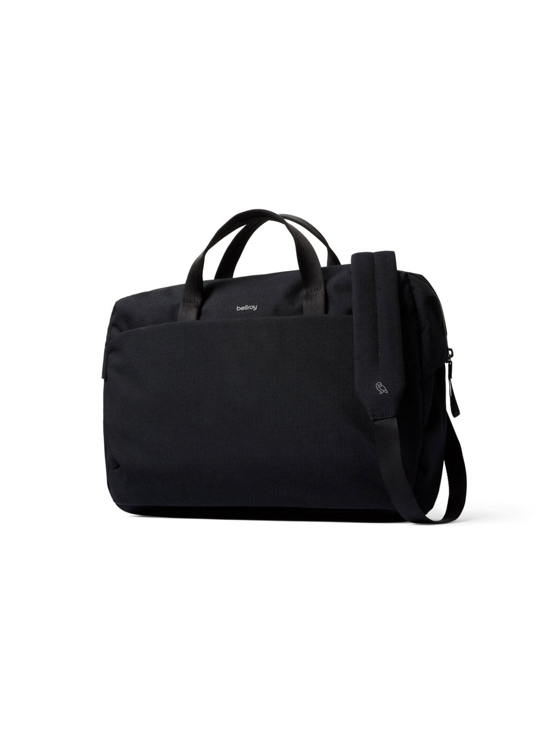 The Bellroy Via Work Bag - 14L is a black tech briefcase made from recycled fabric, with two short handles, a long adjustable shoulder strap, a front pocket, and a subtle logo near the top center, shown on a plain white background.