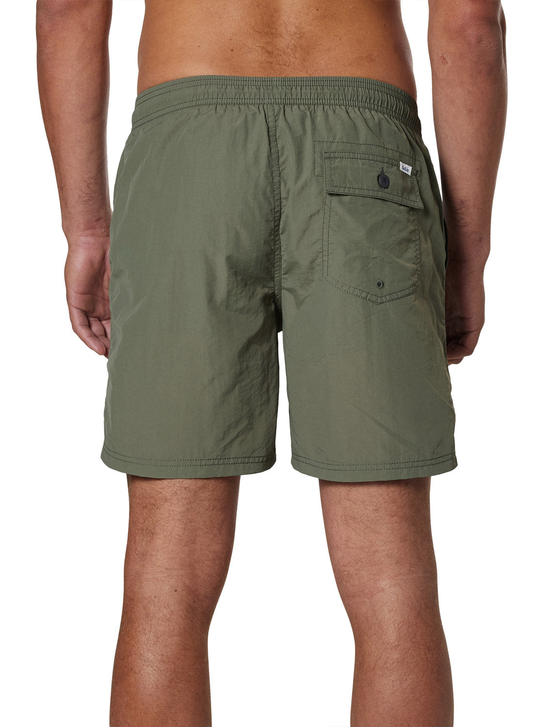 A person is seen from the back wearing Katin Poolside Volley swim trunks in olive green, featuring an elastic waistband, mesh brief lining, and a single buttoned pocket on the right side. The background is plain white.