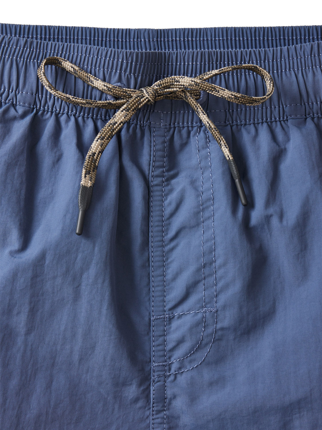 Close-up of the elastic waistband on Katin Poolside Volley shorts, featuring a brown-and-black drawstring tied in a bow and visible vertical center stitching.