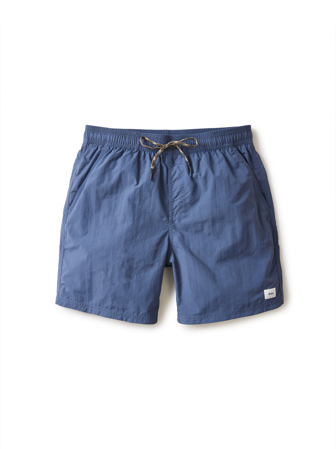 The Katin Poolside Volley swim trunks by Katin feature an elastic waistband, drawstring tie, mesh brief lining, side pockets, and a small white patch near the hem, shown on a plain white background.