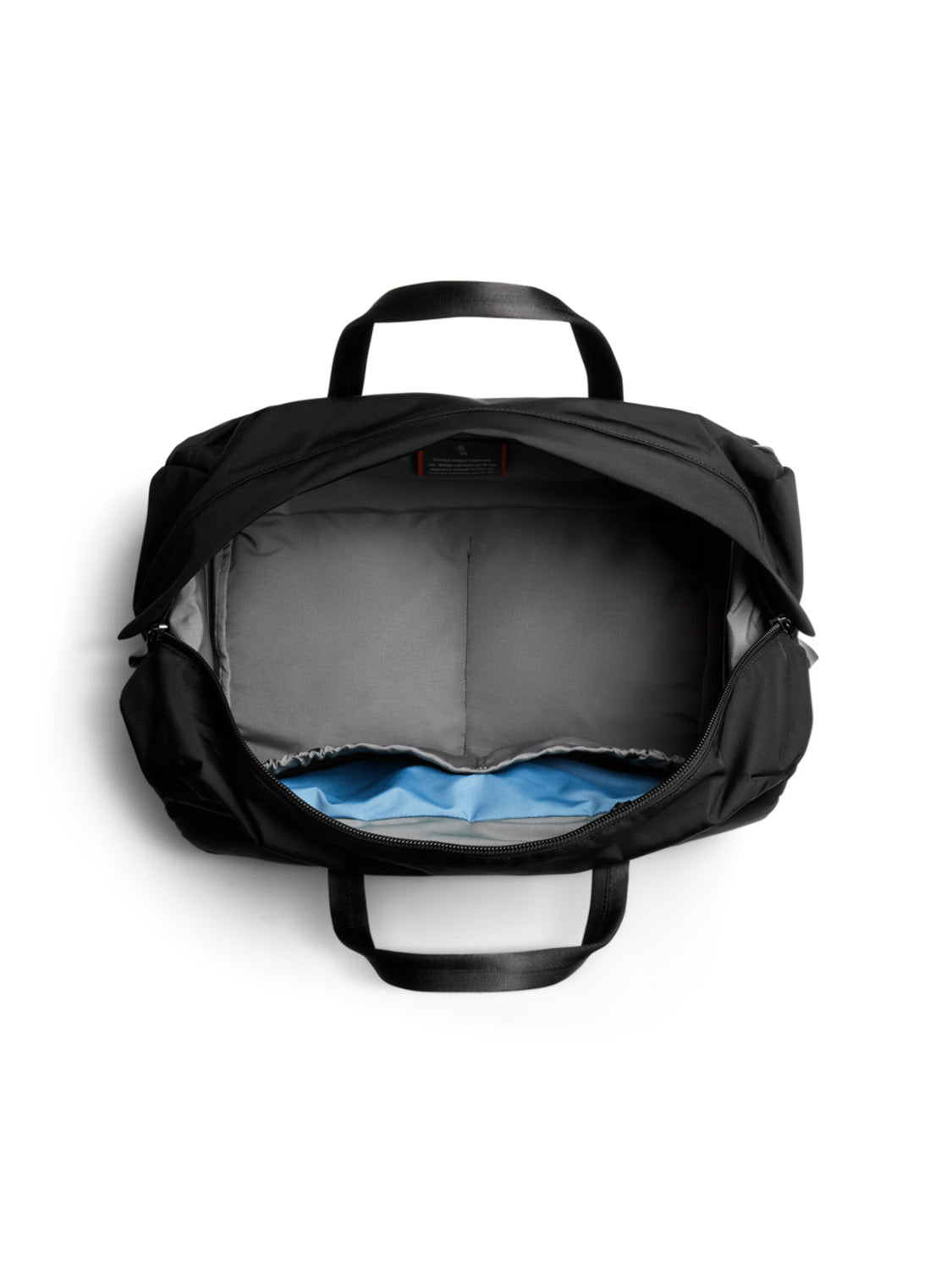 The Bellroy Classic Weekender - 45L is a minimalist duffel bag with grey sides, a blue bottom, and two black handles. Seen from above, its roomy interior looks empty—ideal for weekend trips.