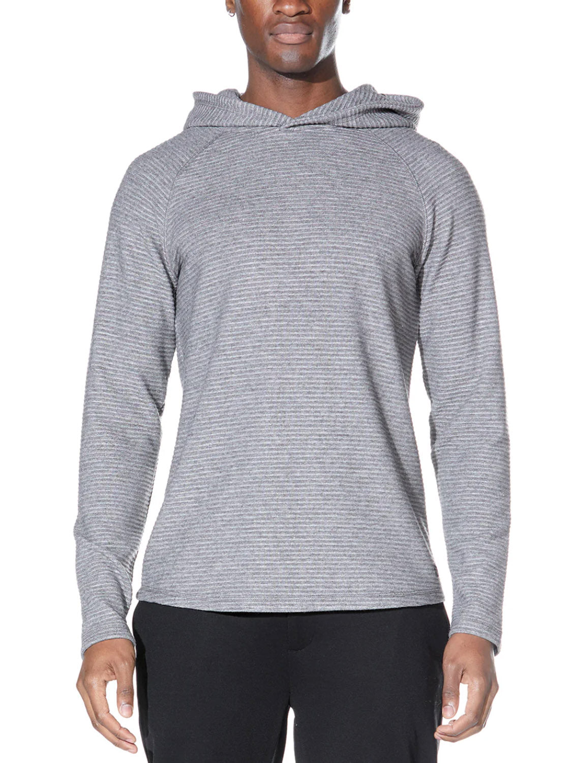 A person wears the Civil Society Wolfe Waffle Knit Hoodie in light gray with subtle horizontal stripes and relaxed raglan sleeves, paired with black pants. The hoodie features a comfortable, relaxed fit, shown against a white background.