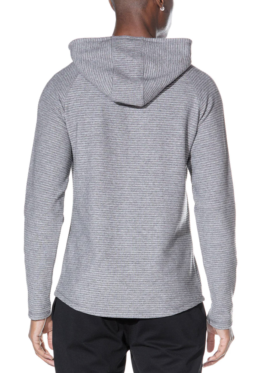 A person is shown from the back wearing the Civil Society Wolfe Waffle Knit Hoodie in light gray with ribbed texture and raglan sleeves, paired with black pants, set against a plain white background.