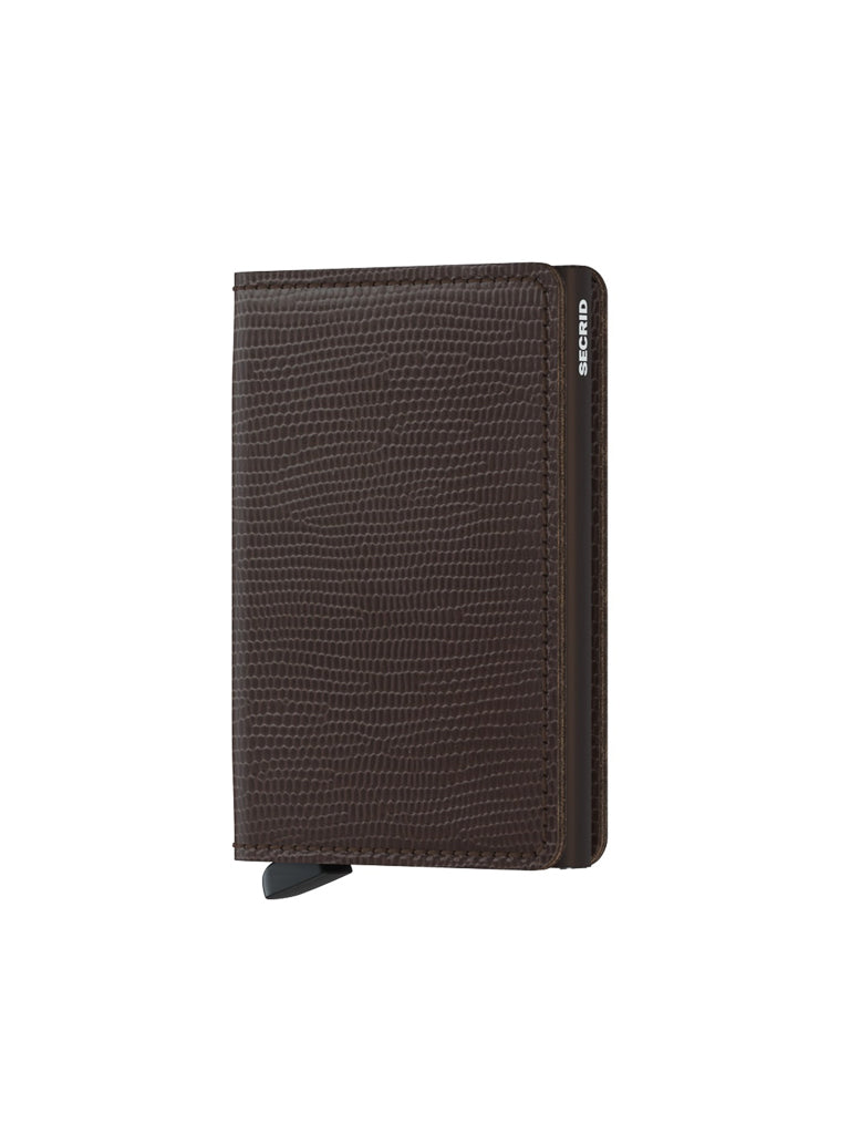 The Secrid Slimwallet Rango Brown Leather is a dark brown textured European leather wallet with RFID protection, a small metal tab at the bottom, and Secrid branding on the side, shown standing upright against a white background.