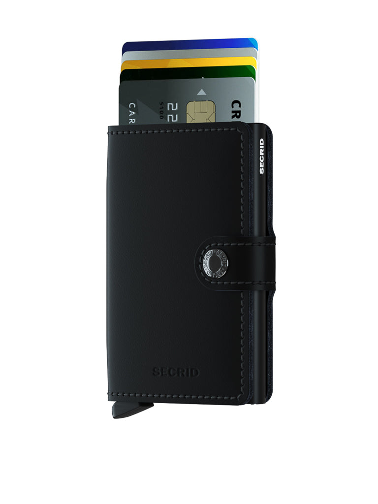 A Secrid Miniwallet Matte Finish Leather in black, shown partially open with several colorful credit cards inside, features a snap closure and a sleek design against a plain white background.