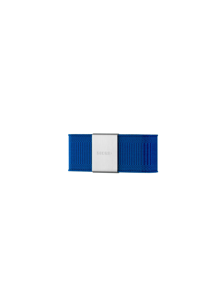 The Secrid Money Band Cardprotector Add-on features blue elastic with a central rectangular silver clasp engraved with SECRID, shown on a plain white background. Designed to pair perfectly with a Secrid Cardprotector.