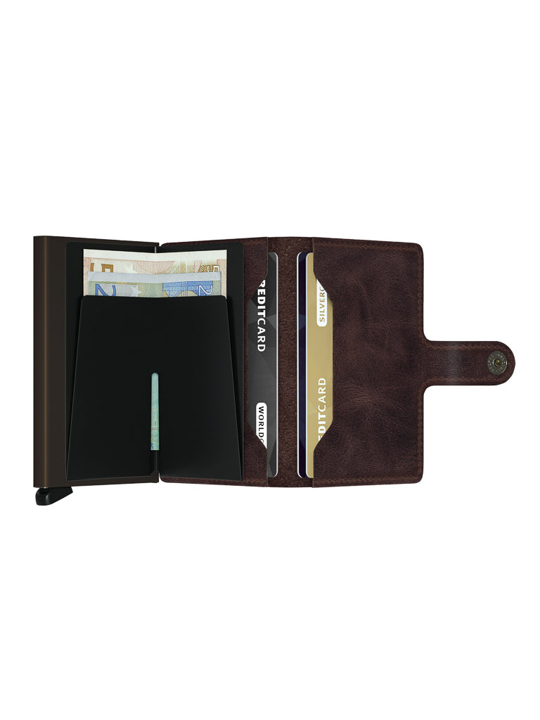 An open Secrid Miniwallet Vintage Leather with a snap button reveals euro banknotes, two credit cards, and a black cardholder compartment inside—a classic design.