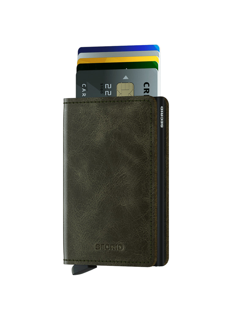 The Secrid Slimwallet Vintage Leather, a dark brown RFID-protected wallet with several credit cards partially extended from the top slot, features the brand logo on the front and side, shown against a plain white background.