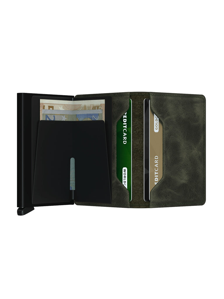 The Secrid Slimwallet Vintage Leather in black and dark green displays several banknotes, three credit cards, a metal money clip inside, and offers RFID protection.