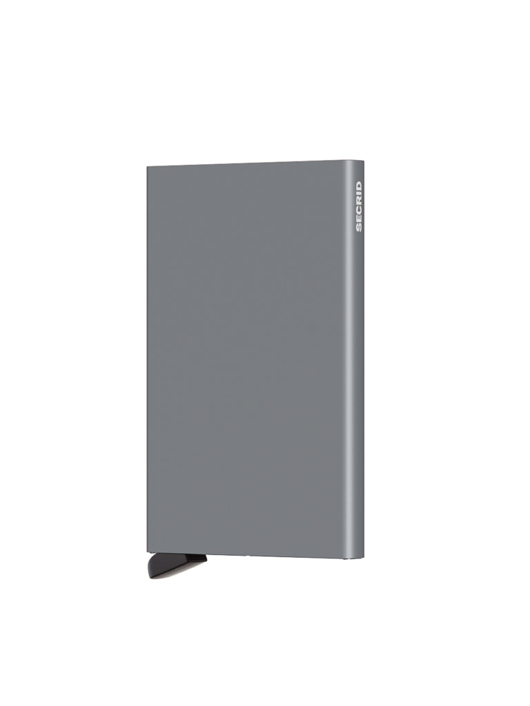 A sleek, rectangular, gray Secrid Cardprotector Minimal Wallet stands vertically against a plain white background, reminiscent of an external hard drive, with the word SECRID printed on the top right edge.
