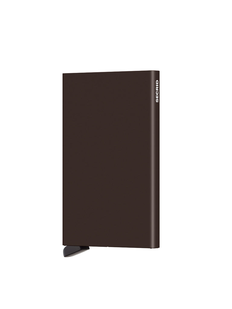 A sleek, rectangular, dark brown Secrid Cardprotector Minimal Wallet, styled with minimalist elegance and shown against a plain white background, featuring a black ribbon detail and subtle branding.